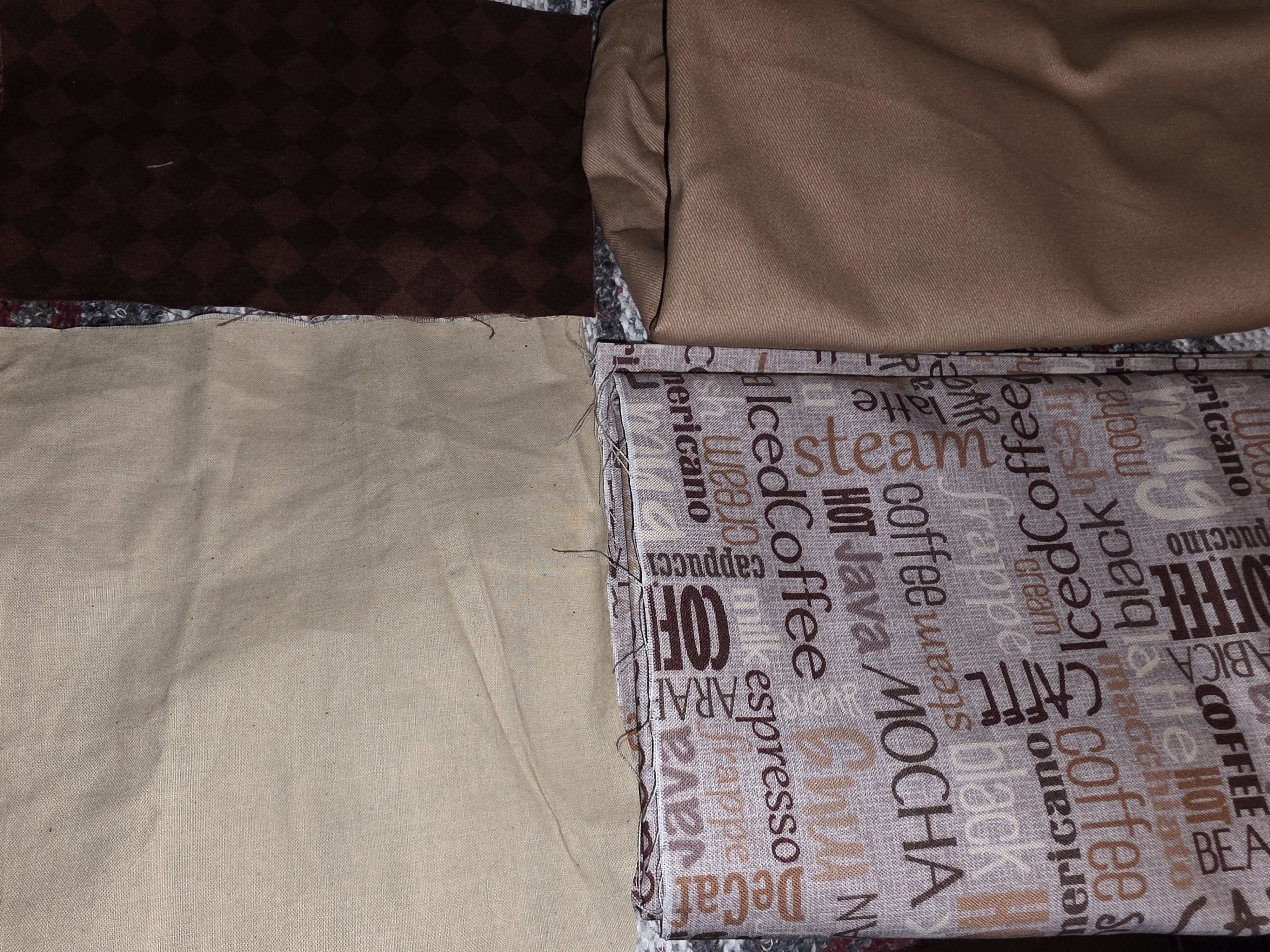 Fabric pieces laid out for the sheet quilt